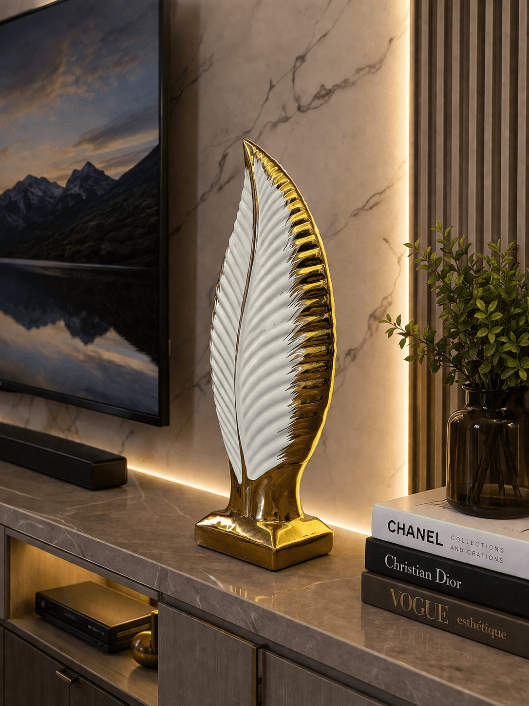 Modern white and gold leaf ceramic showpiece displayed on a living room TV console next to decorative books preview 3